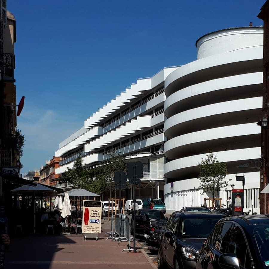 Marché Victor Hugo, where upstairs lunch counters serve meat cut downstairs that morning.