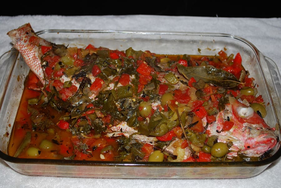 Huachinango a la veracruzana features red snapper braised with tomatoes, capers, and green olives.