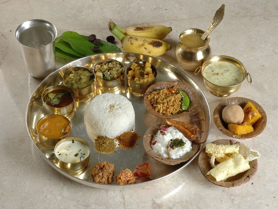 A traditional Andhra mess meal featuring rice, dal, gongura chutney, and sea fish curry.
