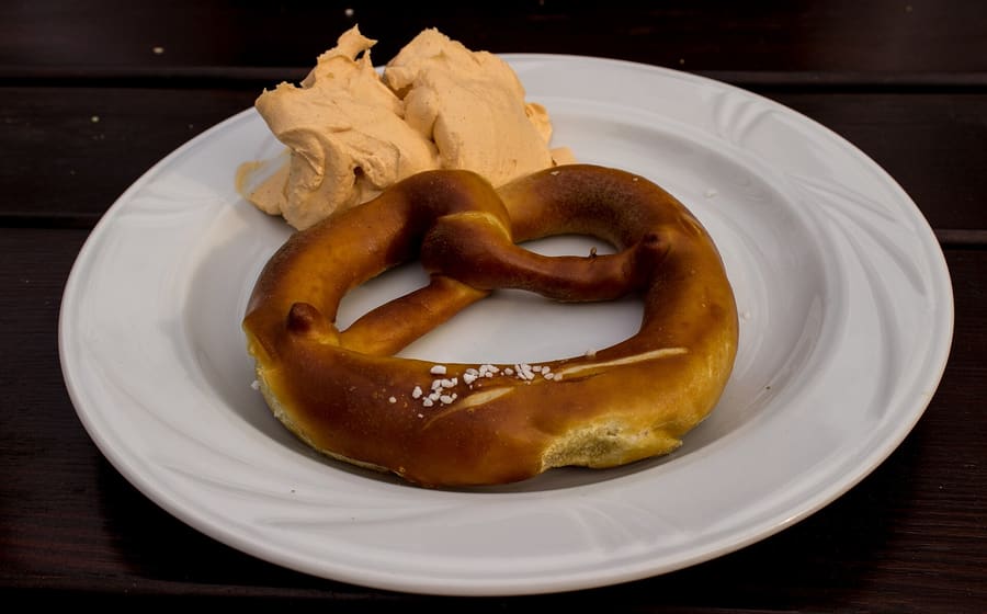 Spundekäs with pretzel biscuits at a traditional wine bar.