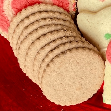 Moravian spice cookies stacked by weight.