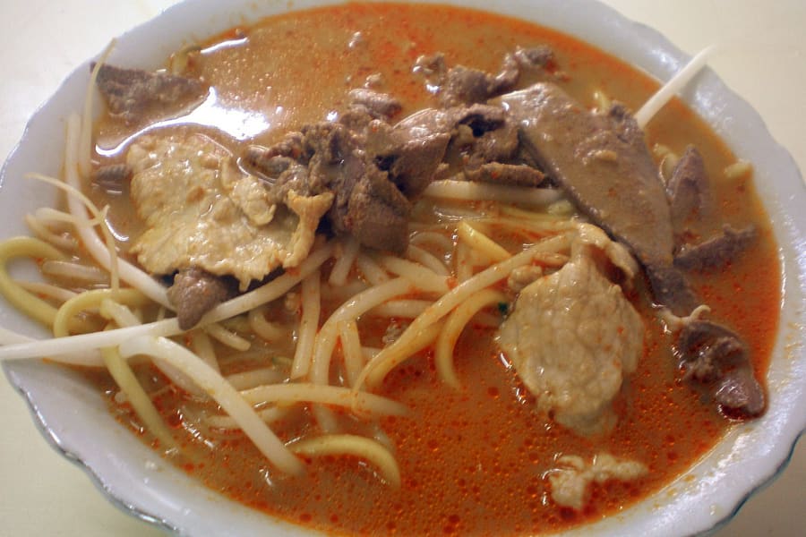 Shacha Mian served with cuttlefish and crisp tofu puffs in a peanut-shrimp broth.