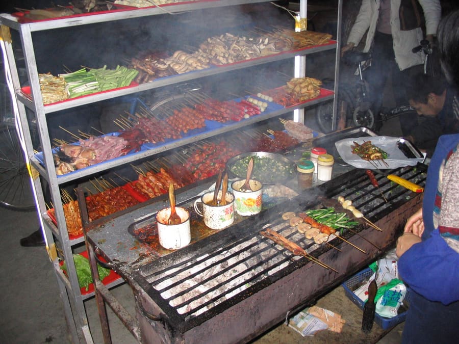 Mutton skewers cook over personal charcoal stoves at a local Xuzhou restaurant.
