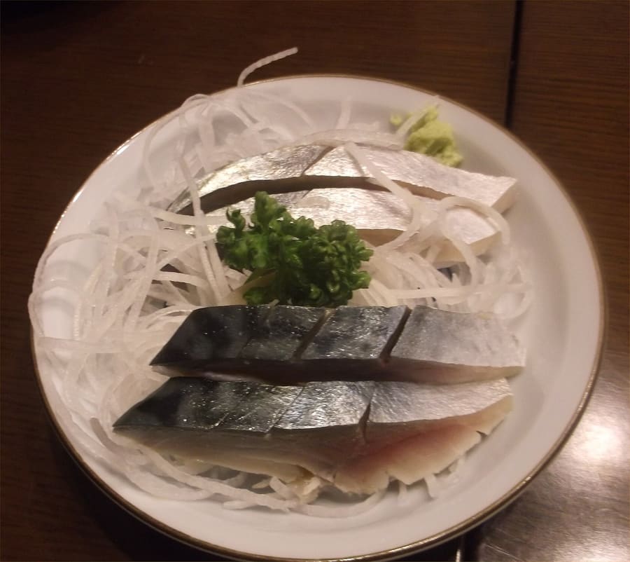Saba (mackerel) sashimi served fresh at izakayas near Yonago Station.